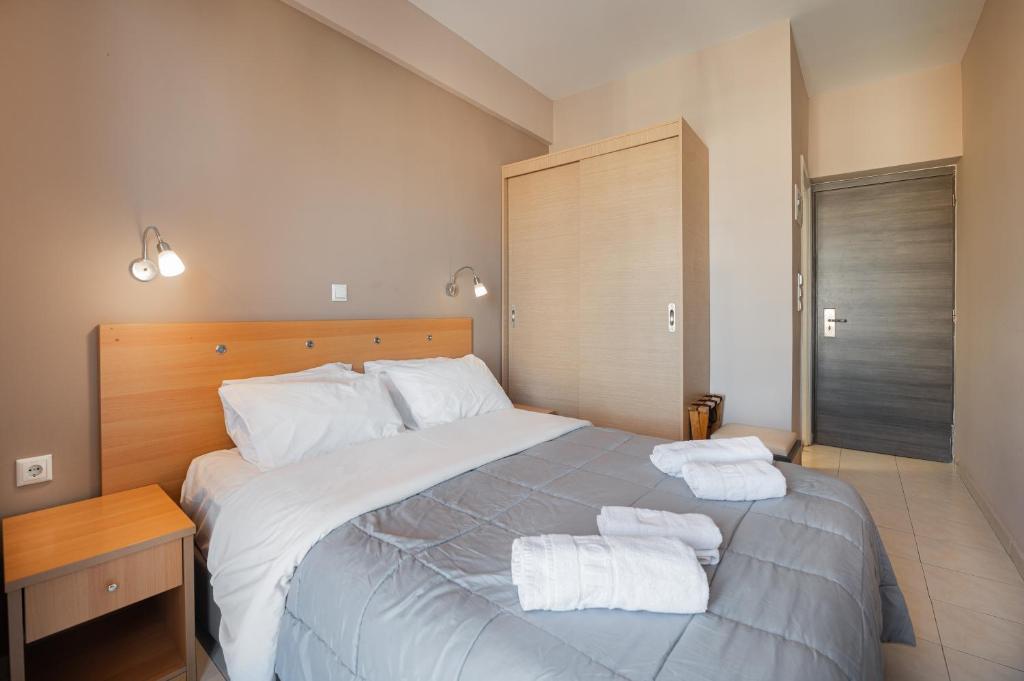 Ένα ή περισσότερα κρεβάτια σε δωμάτιο στο Diros Hotel