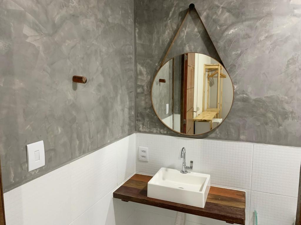 a bathroom with a sink and a mirror at CASA MAR DE FORA in Fernando de Noronha