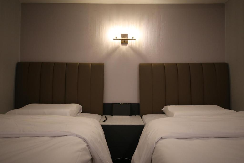 Postel nebo postele na pokoji v ubytování 25 Hotel
