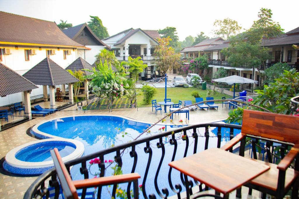 a view of a pool from the balcony of a resort at Vang Vieng Diamond Resort in Vang Vieng