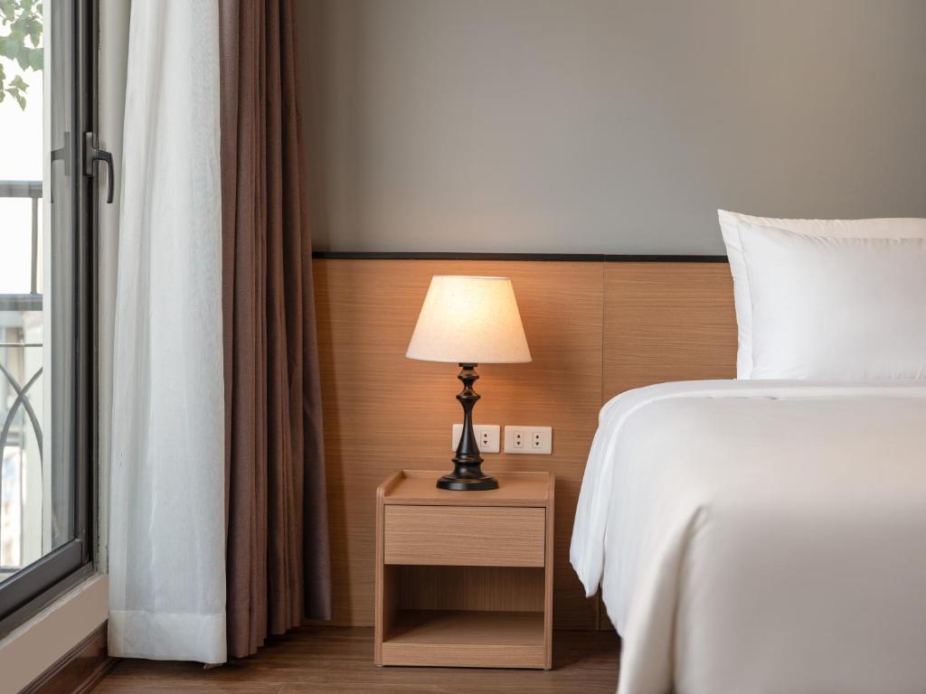 Postel nebo postele na pokoji v ubytování Minasi Hotel & Spa