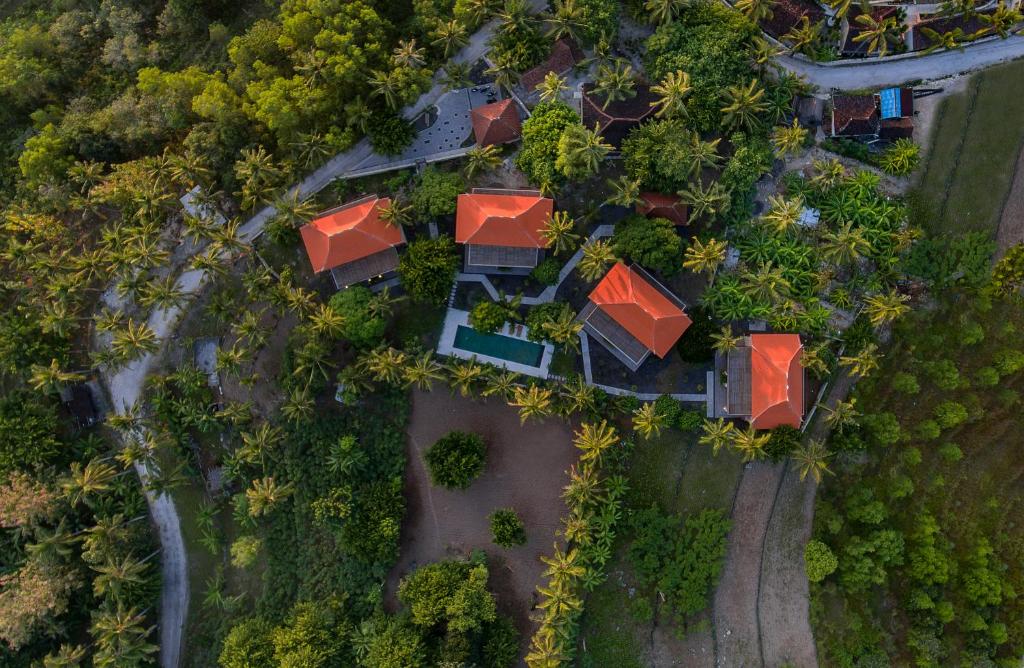 an overhead view of a house with red roofs at Diamond Beach Villas in Nusa Penida