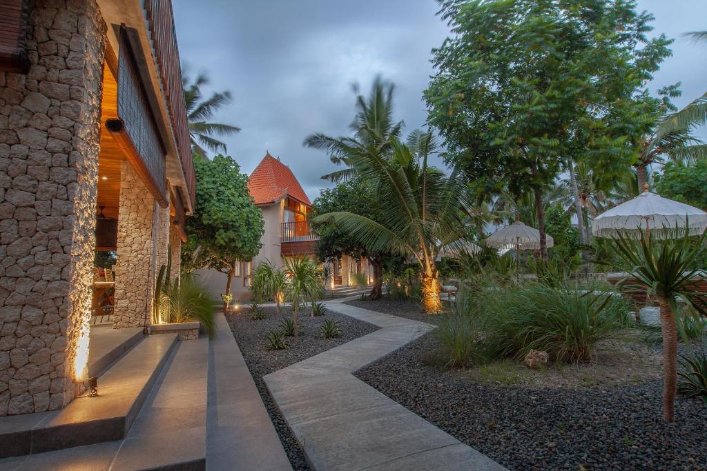 a building with a walkway in front of a building at Diamond Beach Villas in Nusa Penida