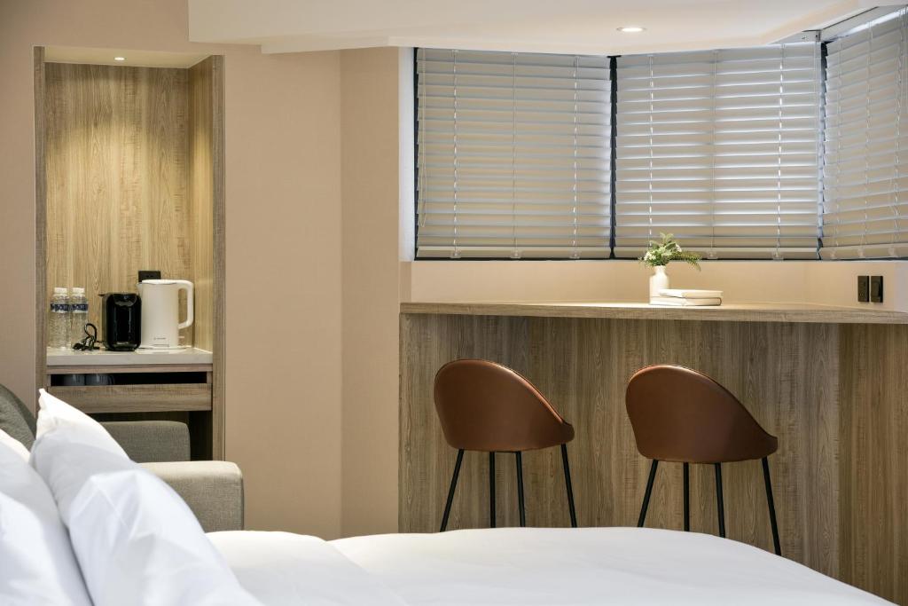 Postel nebo postele na pokoji v ubytování Spring Rhapsody Hotel