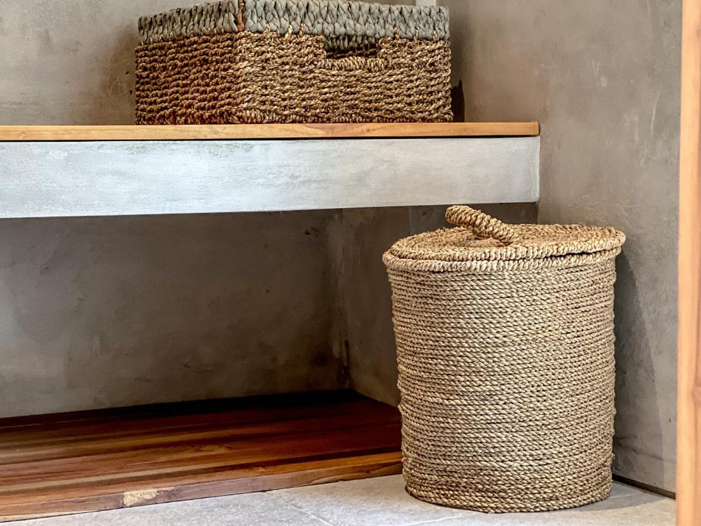 two baskets sitting on top of a shelf at Diamond Beach Villas in Nusa Penida
