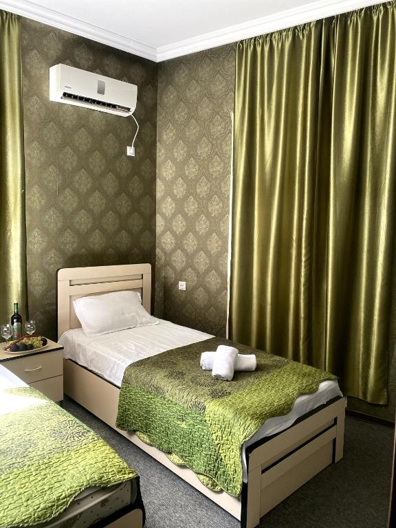 Postel nebo postele na pokoji v ubytování Hotel Shalimar