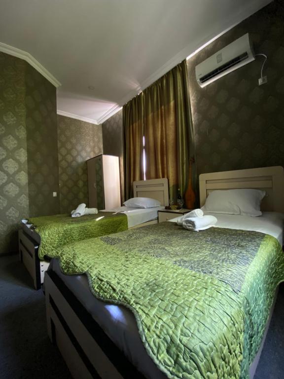 Postel nebo postele na pokoji v ubytování Hotel Shalimar