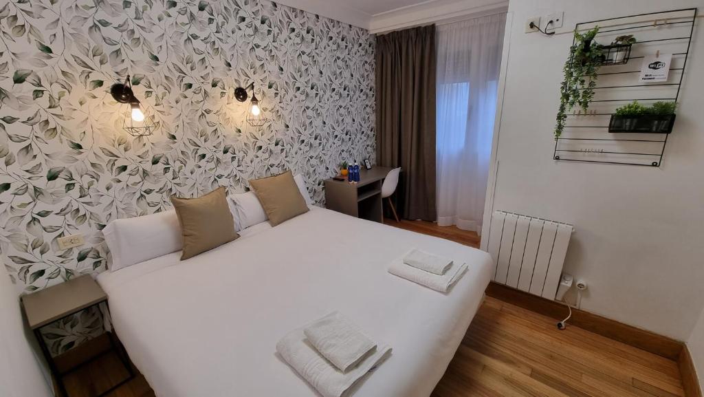 Postel nebo postele na pokoji v ubytování Hotel Norte