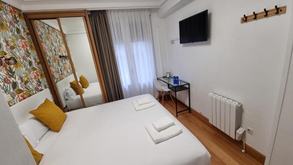 Postel nebo postele na pokoji v ubytování Hotel Norte