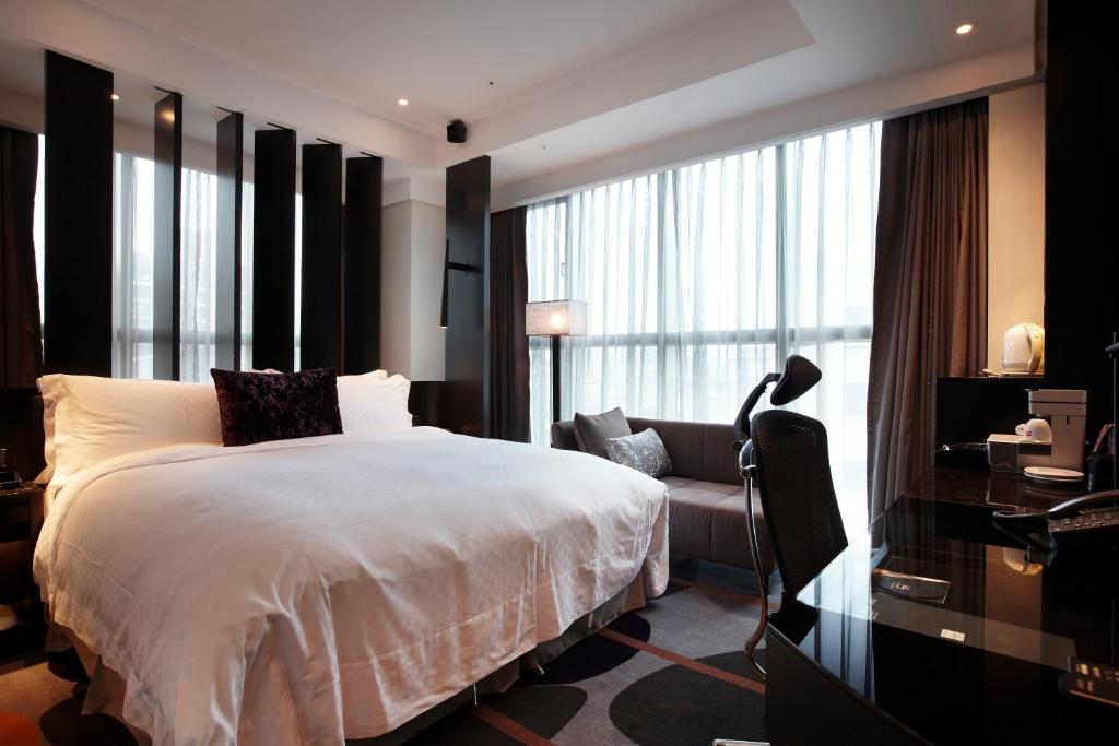 Postel nebo postele na pokoji v ubytování The Tango Hotel Taipei ChangAn