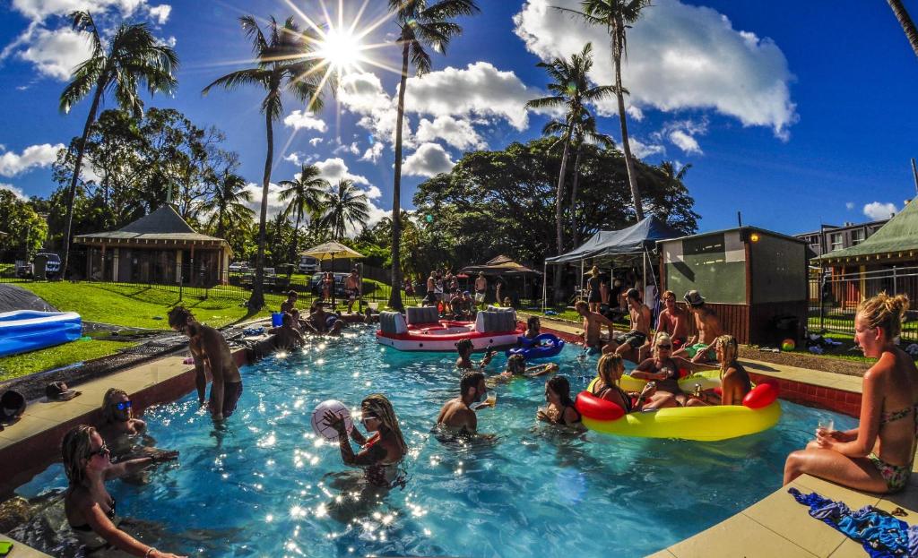 a group of people in the water at a water park at Nomads Airlie Beach in Airlie Beach