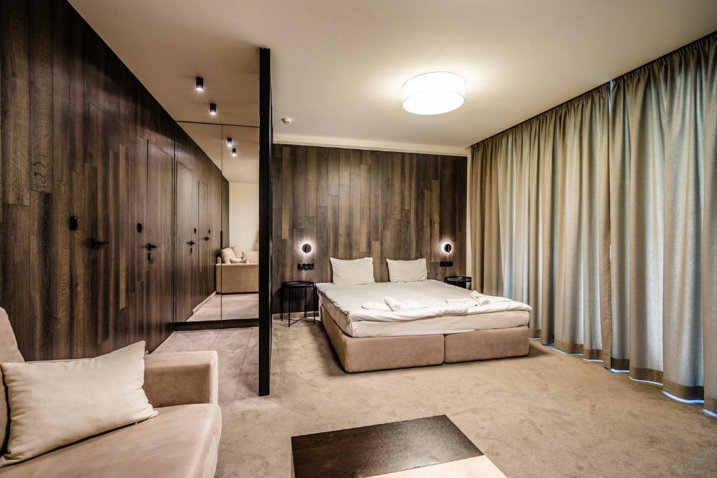 Postel nebo postele na pokoji v ubytování Perun Hotel Sandanski