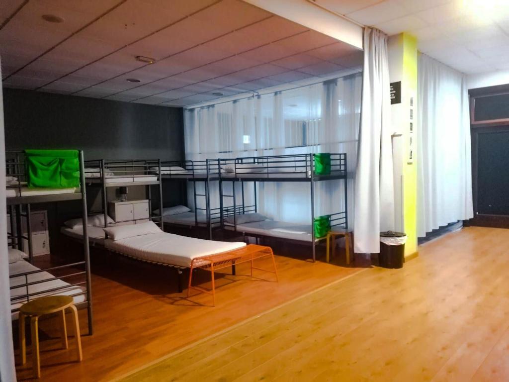Postel nebo postele na pokoji v ubytování Albergue Rem