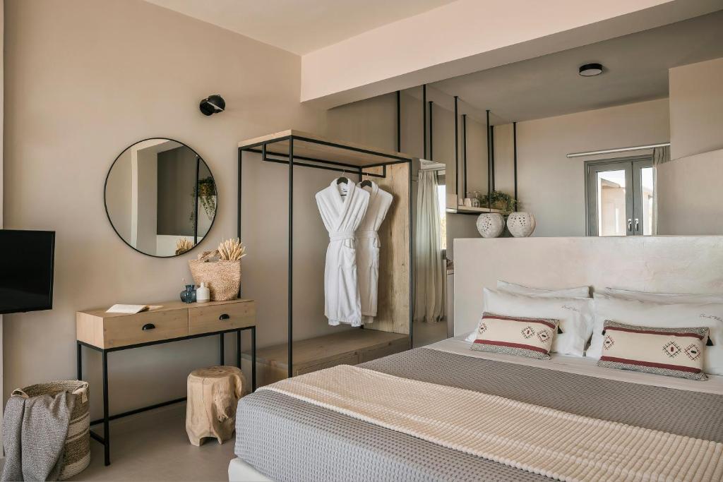 A bed or beds in a room at Votsalo Suite-Grand Blue Beach Residence