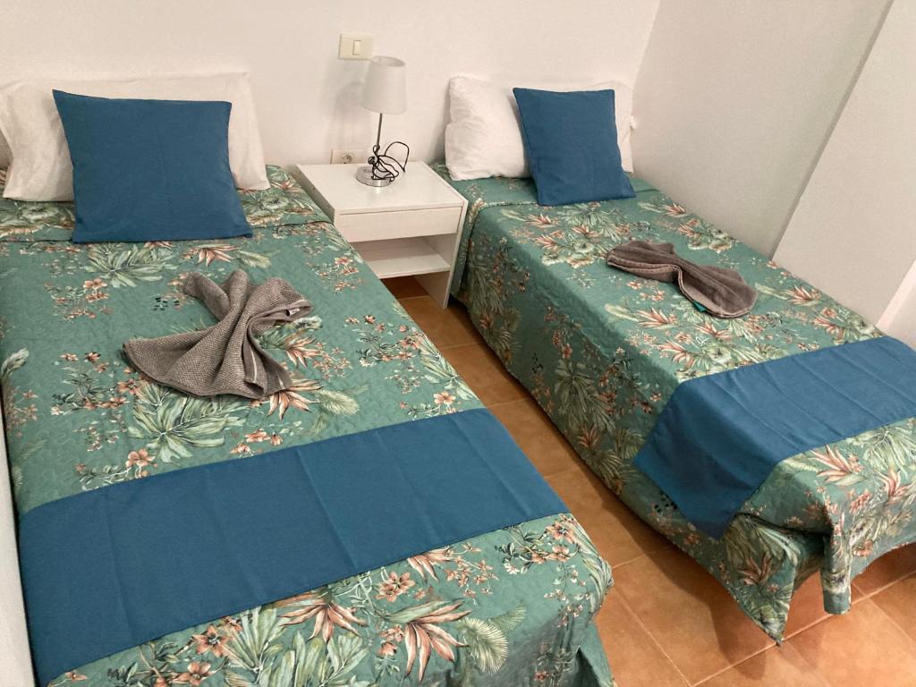 Posteľ alebo postele v izbe v ubytovaní MARTSARAs PLAYA SARDINA