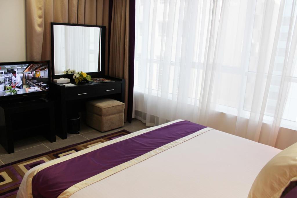 Postel nebo postele na pokoji v ubytování Al Diar Sawa Hotel Apartments