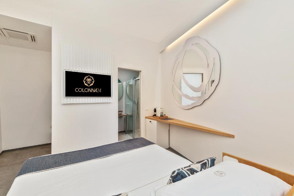 Postel nebo postele na pokoji v ubytování Colonna 24 Luxury Room in Portovenere near 5 Terre