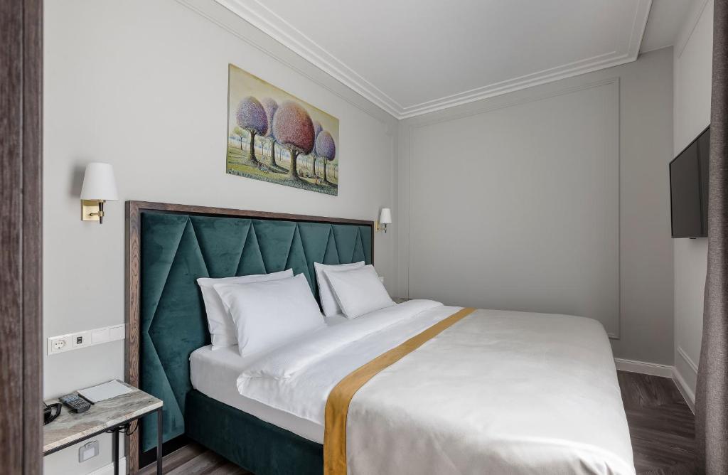Postel nebo postele na pokoji v ubytování VICTORIA Hotel Klaipėda
