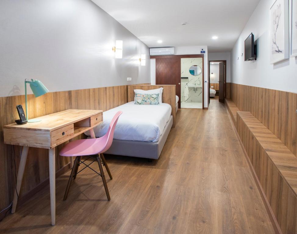 Postel nebo postele na pokoji v ubytování Hotel Rural Solar das Arcadas