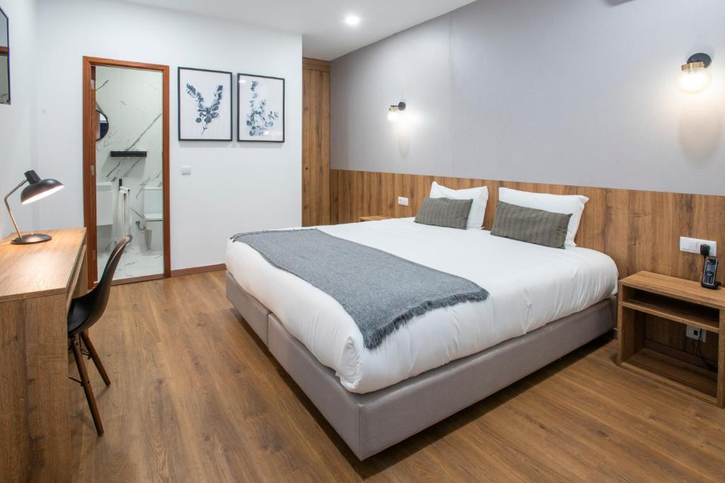 Postel nebo postele na pokoji v ubytování Hotel Rural Solar das Arcadas