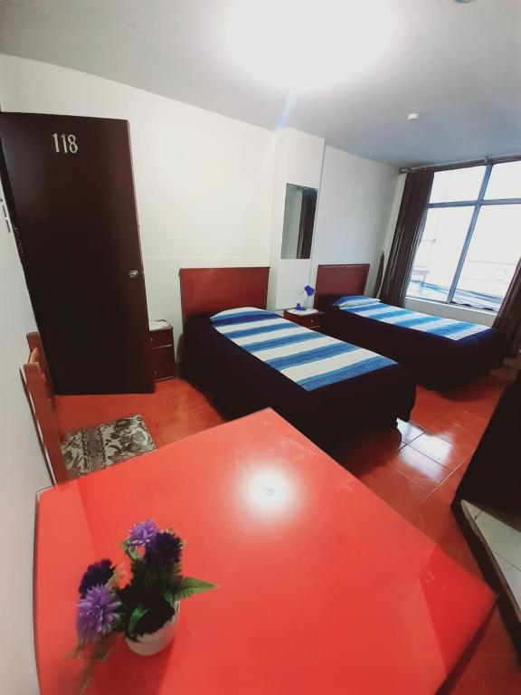 Postel nebo postele na pokoji v ubytování Hotel Central