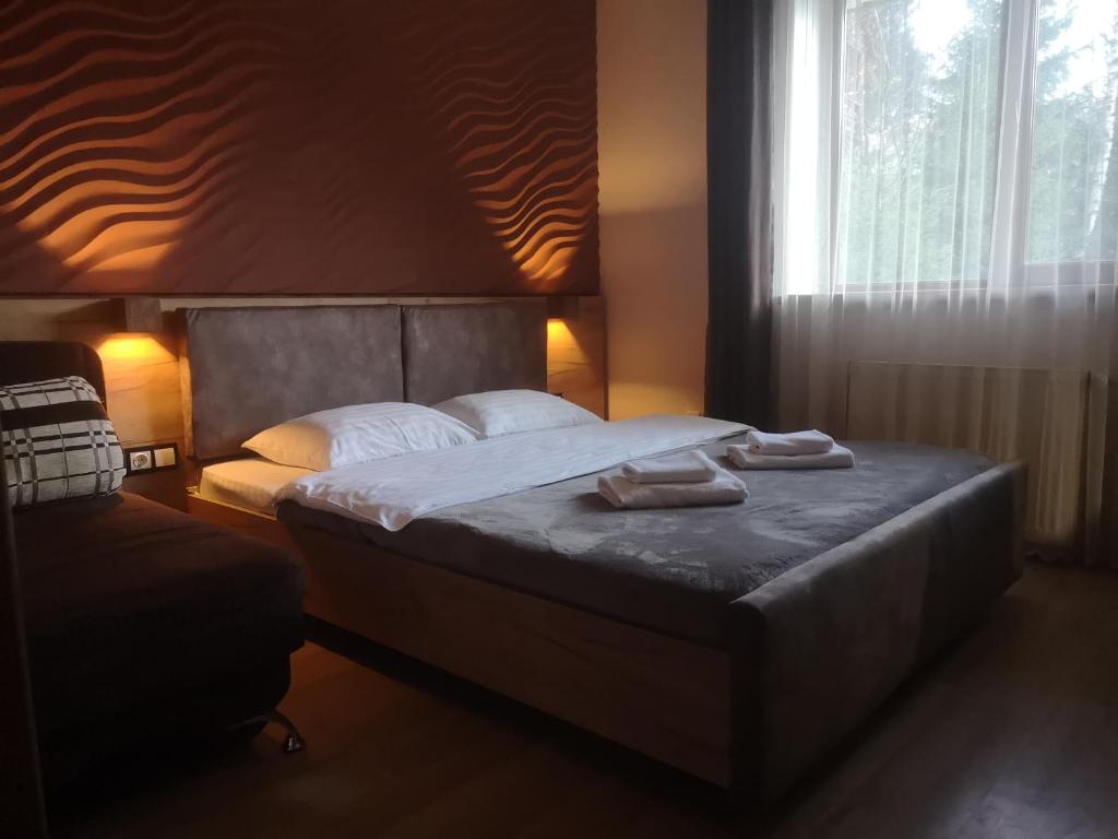 Postel nebo postele na pokoji v ubytování Hotel Bereg