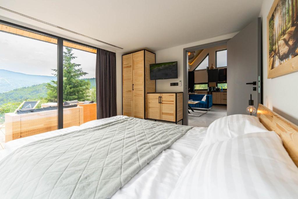 Posteľ alebo postele v izbe v ubytovaní Osada Mountain Villas Szczyrk - domki z balią i sauną - piękny widok na góry - Dream Apart