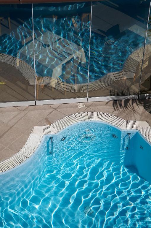 Bazén v ubytování Arciduca Grand Hotel nebo v jeho okolí
