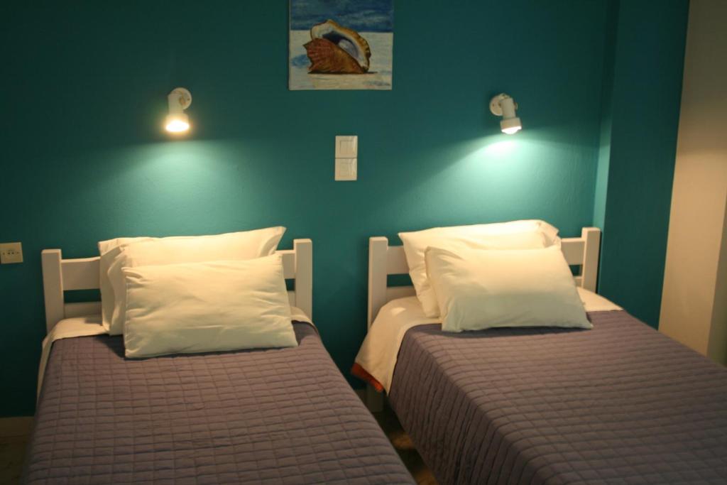 Posteľ alebo postele v izbe v ubytovaní Nereides Hotel