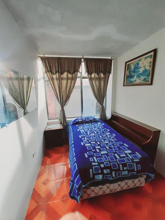 Postel nebo postele na pokoji v ubytování Hotel Central