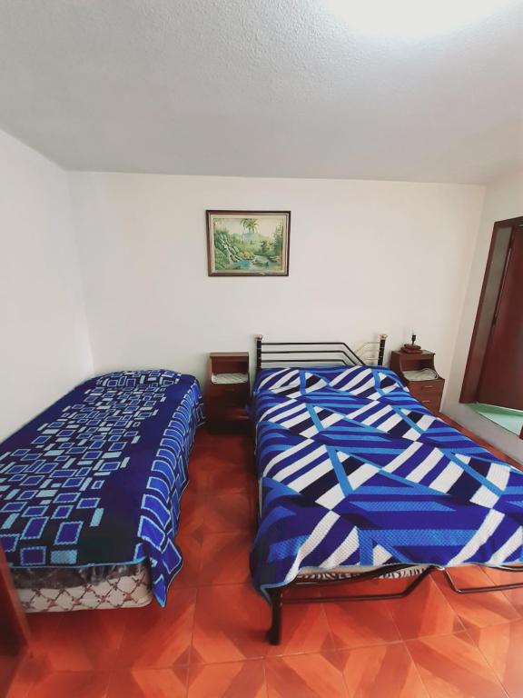Postel nebo postele na pokoji v ubytování Hotel Central