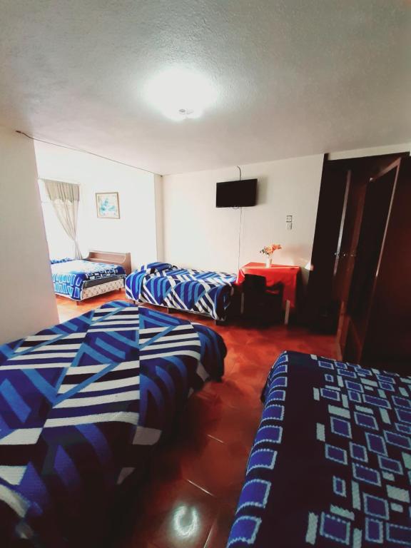 Postel nebo postele na pokoji v ubytování Hotel Central