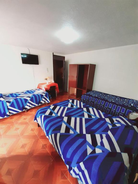 Postel nebo postele na pokoji v ubytování Hotel Central