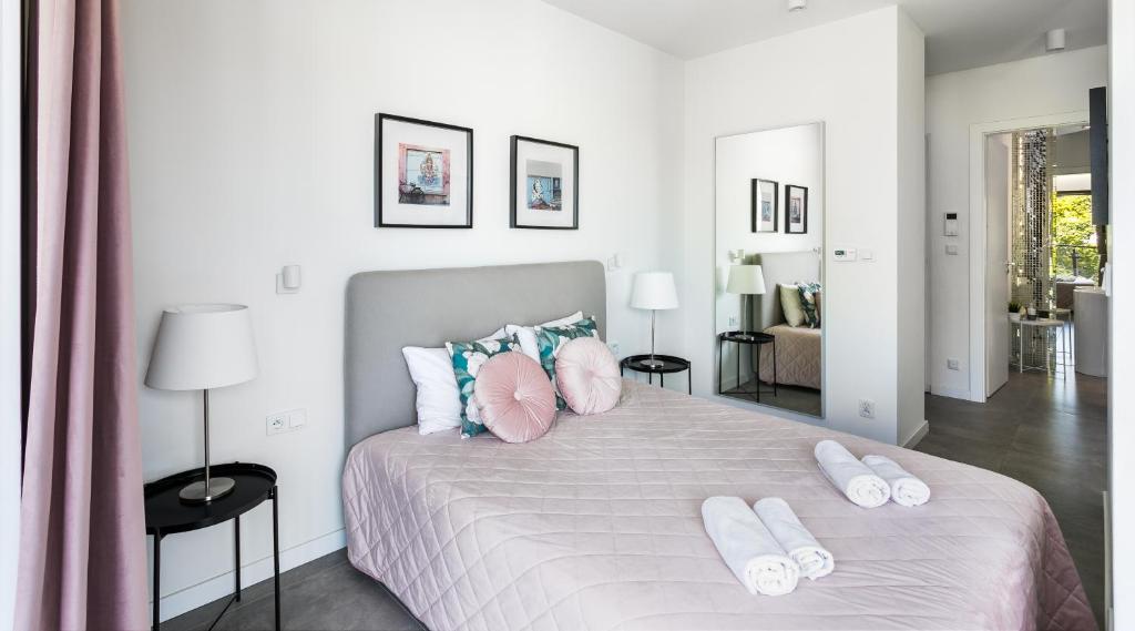Posteľ alebo postele v izbe v ubytovaní MY KRAKOW Apartments - Rakowicka
