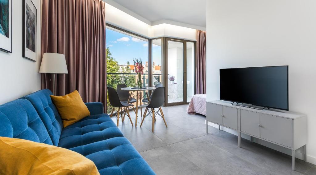 Televízia a/alebo spoločenská miestnosť v ubytovaní MY KRAKOW Apartments - Rakowicka