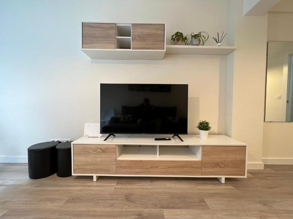 TV a/nebo společenská místnost v ubytování Apartamento Quintana