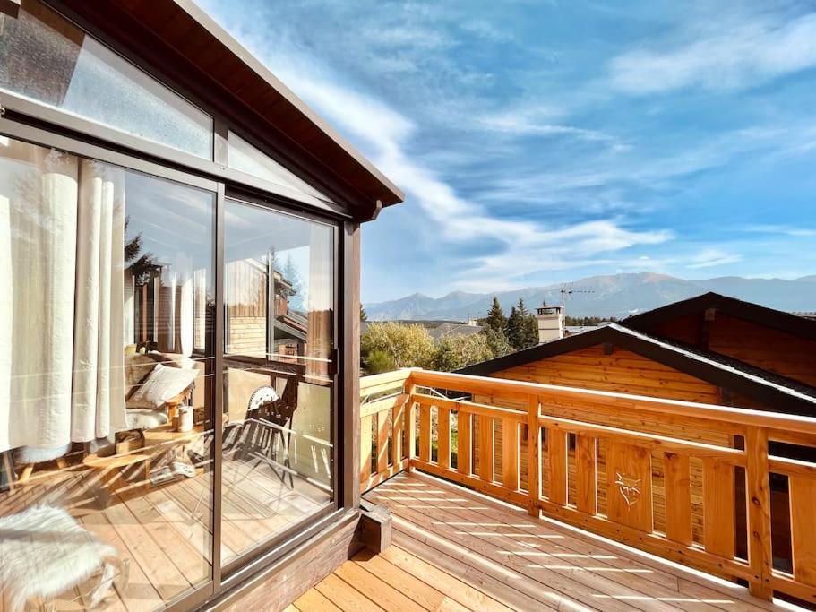 a balcony with a view of the mountains at Bolquère I Beau chalet familial proche des pistes in Bolquere Pyrenees 2000