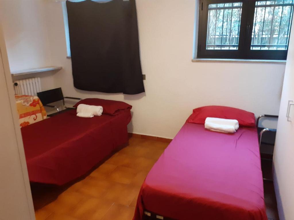Łóżko lub łóżka w pokoju w obiekcie Taverna tranquillissima indipendente