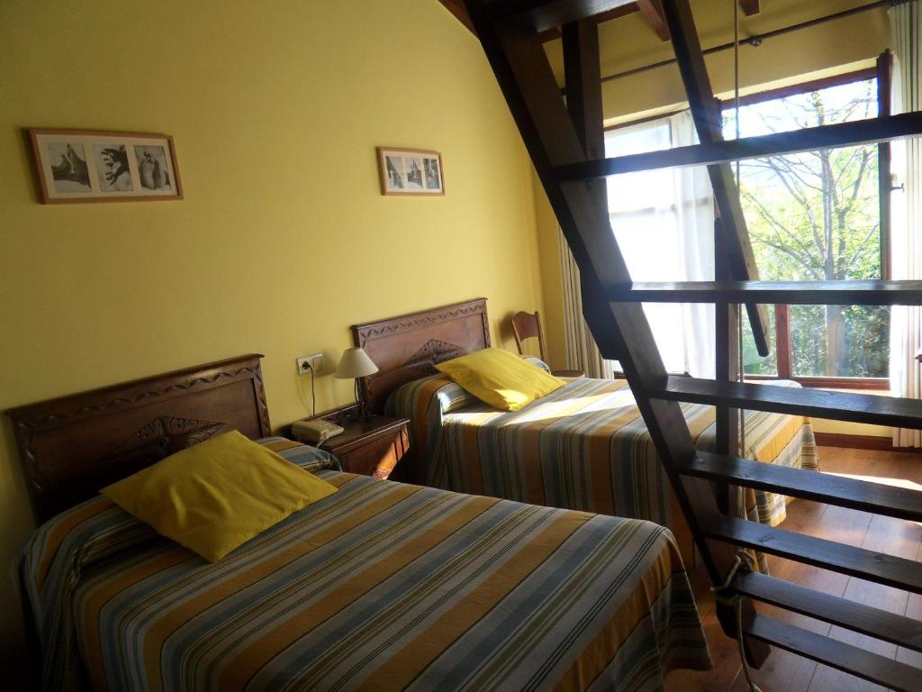 Postel nebo postele na pokoji v ubytování Hotel El Carmen