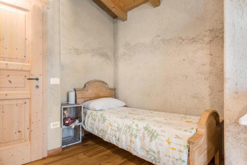 Łóżko lub łóżka w pokoju w obiekcie Baita Al Rossat