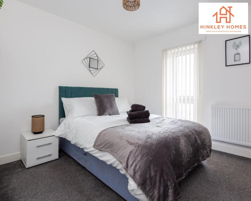a white bedroom with a large bed and a window at Newbuild 4bed - City Centre - Free secure parking! By Hinkley Homes Short Lets & Serviced Accommodation in Liverpool
