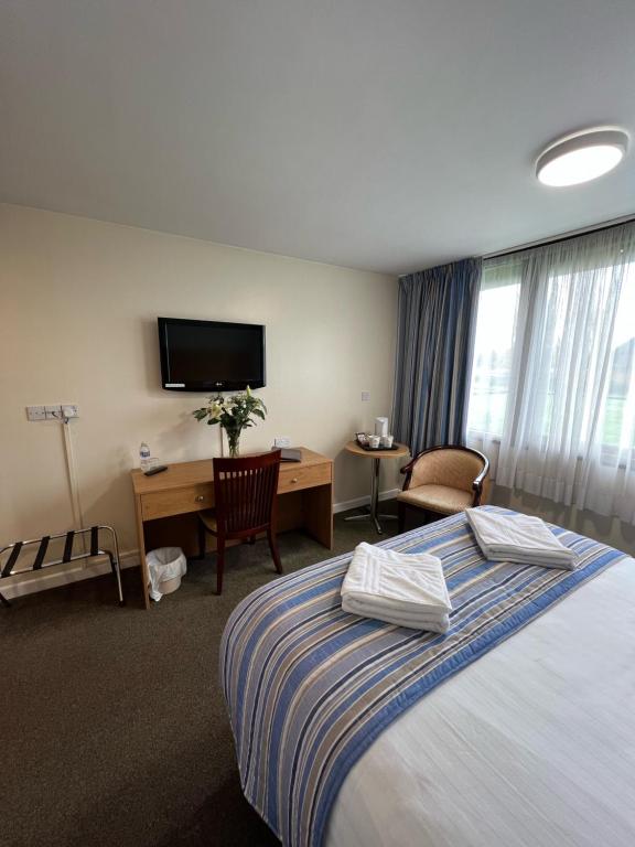 Postel nebo postele na pokoji v ubytování Hermitage Park Hotel