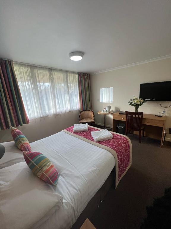 Postel nebo postele na pokoji v ubytování Hermitage Park Hotel