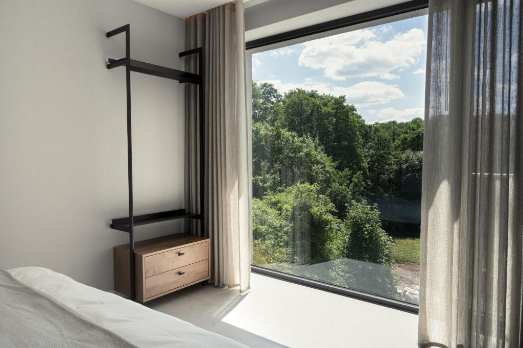 Postel nebo postele na pokoji v ubytování Hotel VierJahreszeiten am Seilersee