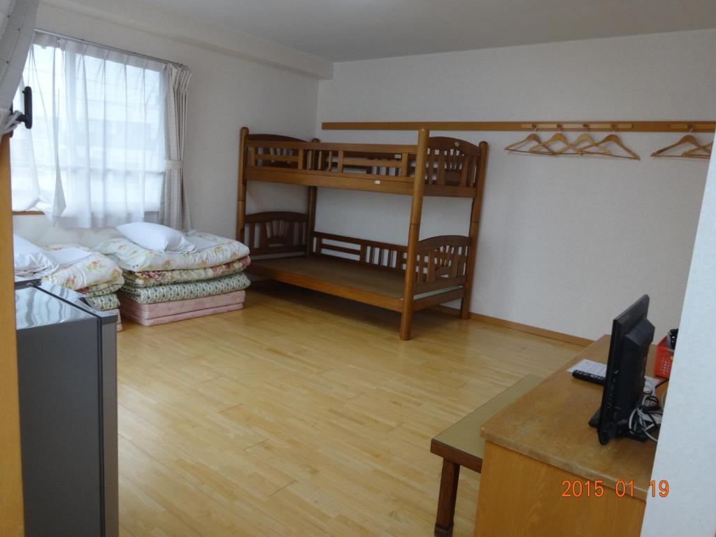Postel nebo postele na pokoji v ubytování Minshuku Getto