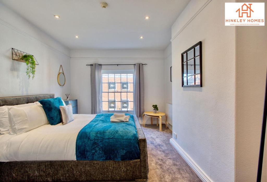 a bedroom with a large bed and a window at The Highstreet Retreat - Luxurious, Central & Spacious! By Hinkley Homes Short Lets & Serviced Accommodation in Bridgwater