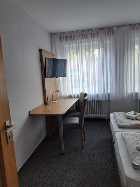 Postel nebo postele na pokoji v ubytování Desperados Hotel