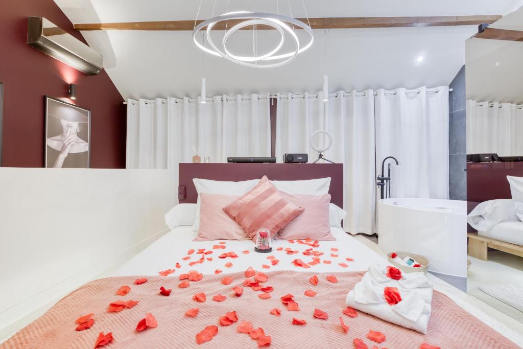 a bedroom with a bed with red roses on it at Luxury Collection &amp; Resort in Cormeilles-en-Parisis