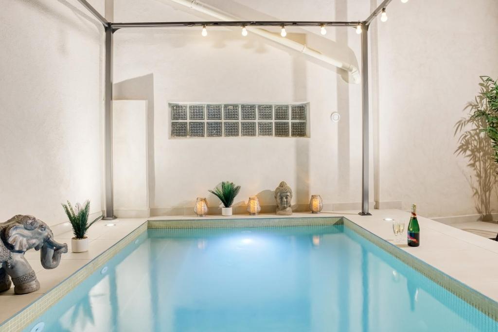 a swimming pool in a room with a swimming pool at Luxury Collection &amp; Resort in Cormeilles-en-Parisis
