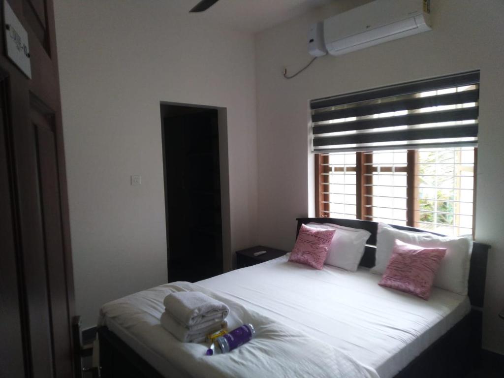 Llit o llits en una habitació de Dune Homestay